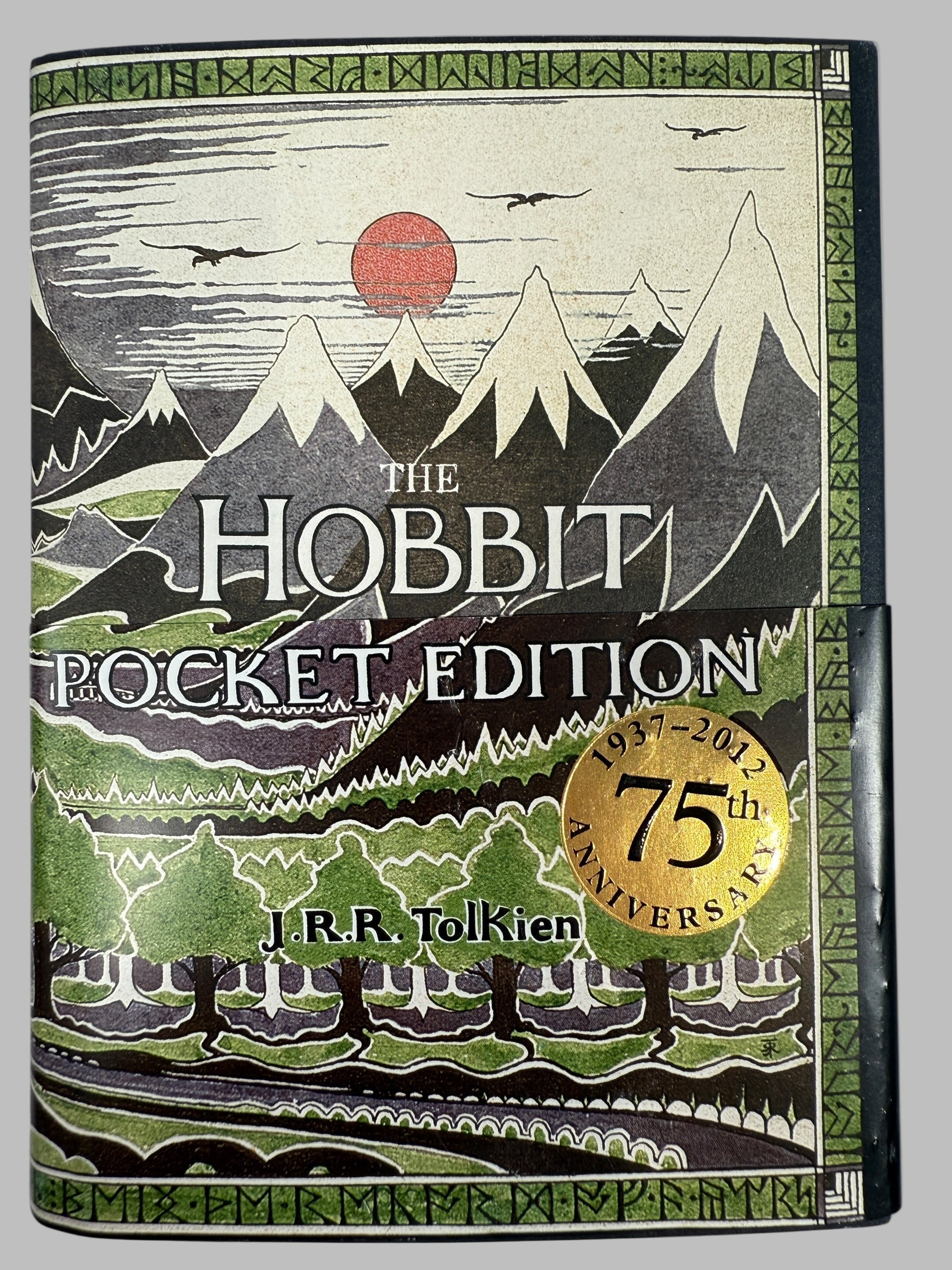 The Hobbit Pocket Edition book cover with mountain and landscape design