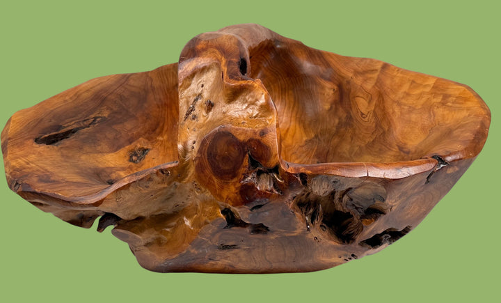 Wooden sculpture with natural grain and texture on a white background