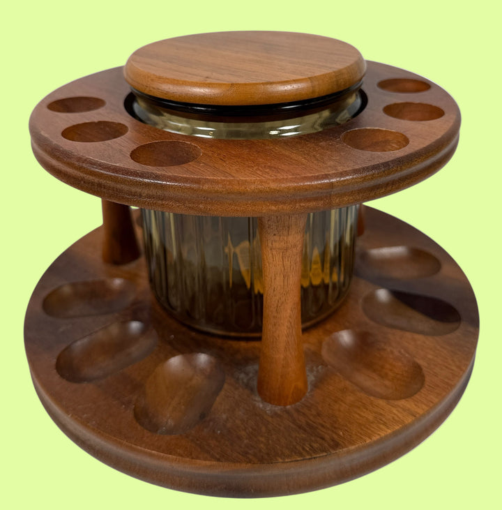 Wooden yarn winder with a central spool on a white background