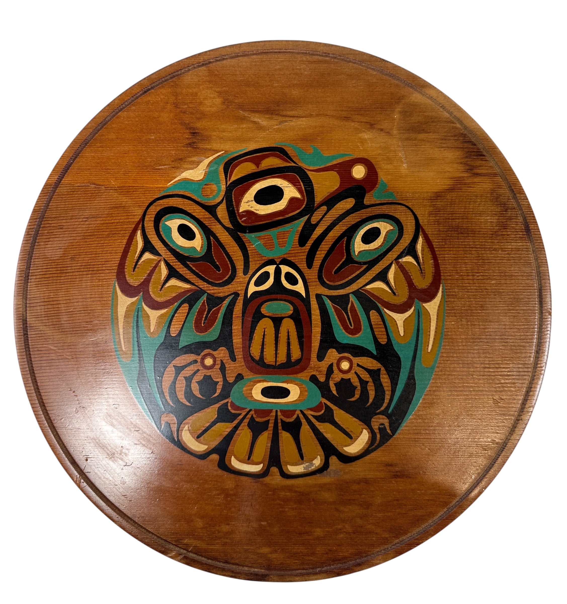 Wooden plate with a colorful owl design on a white background