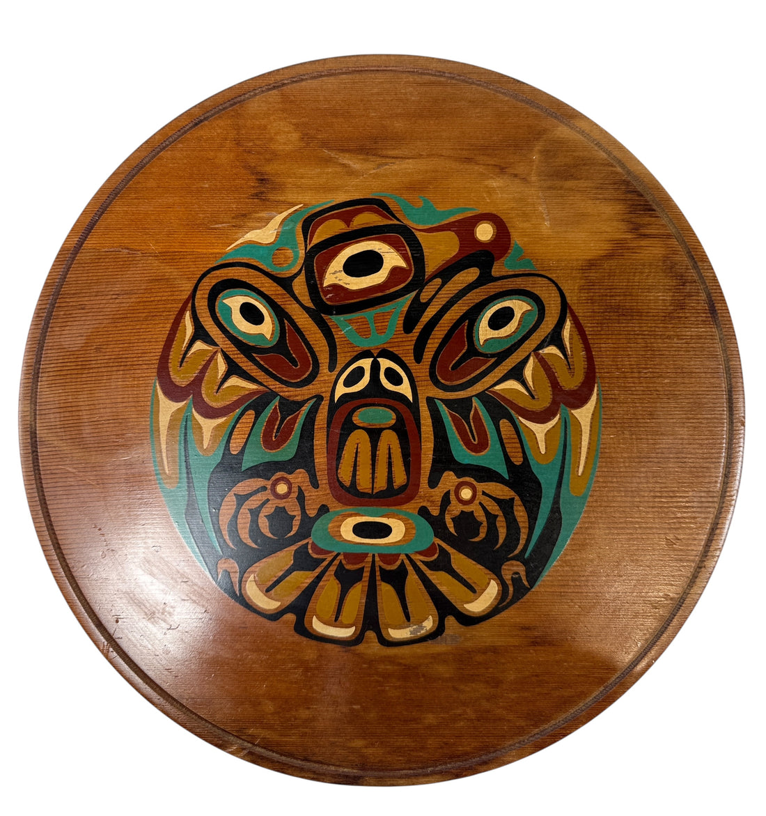 Wooden plate with a colorful owl design on a white background