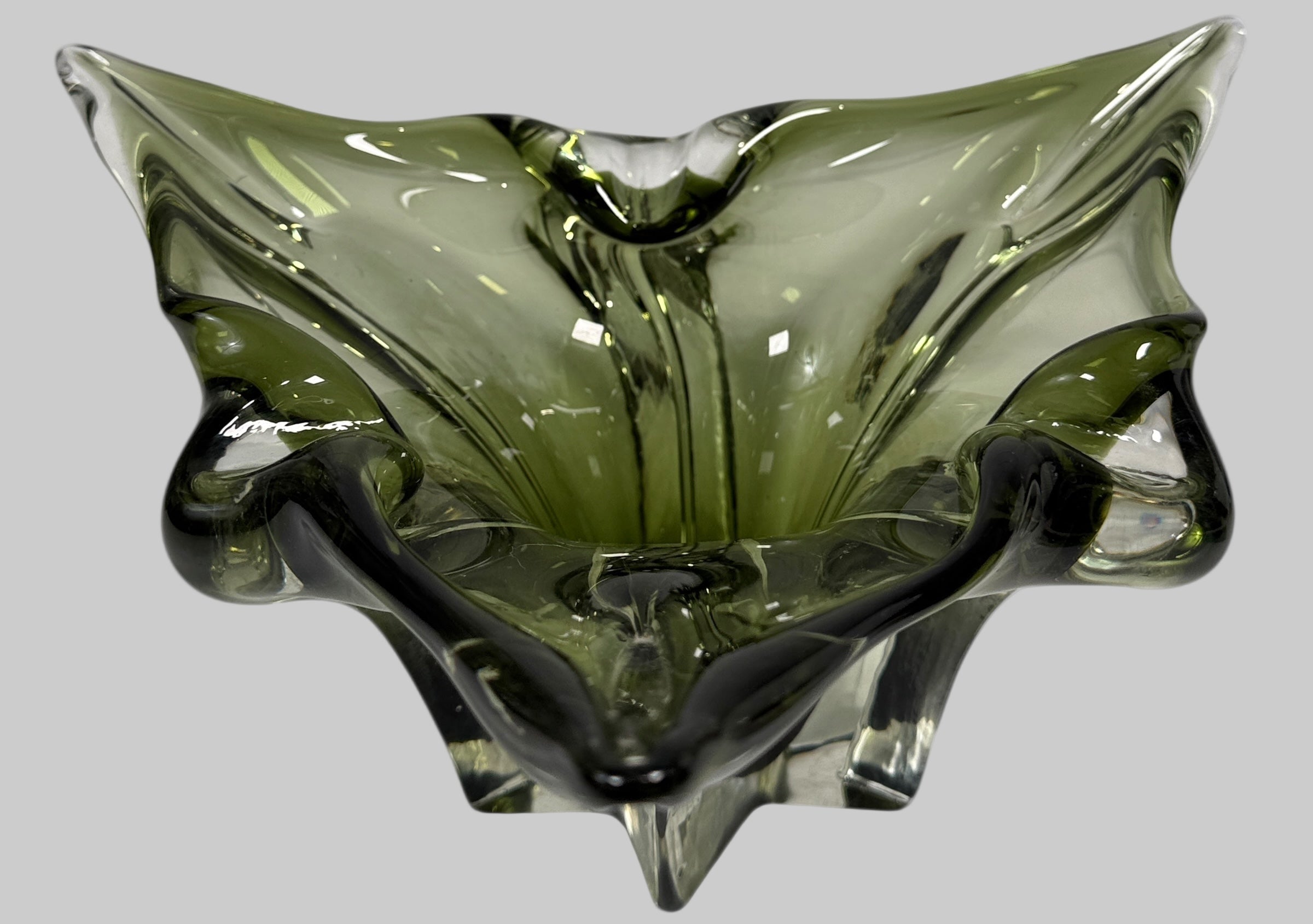 Chalet Green glass bowl with a unique, organic shape on a white background