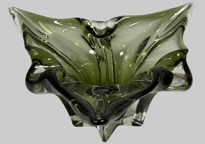 Chalet Green glass bowl with a unique, organic shape on a white background