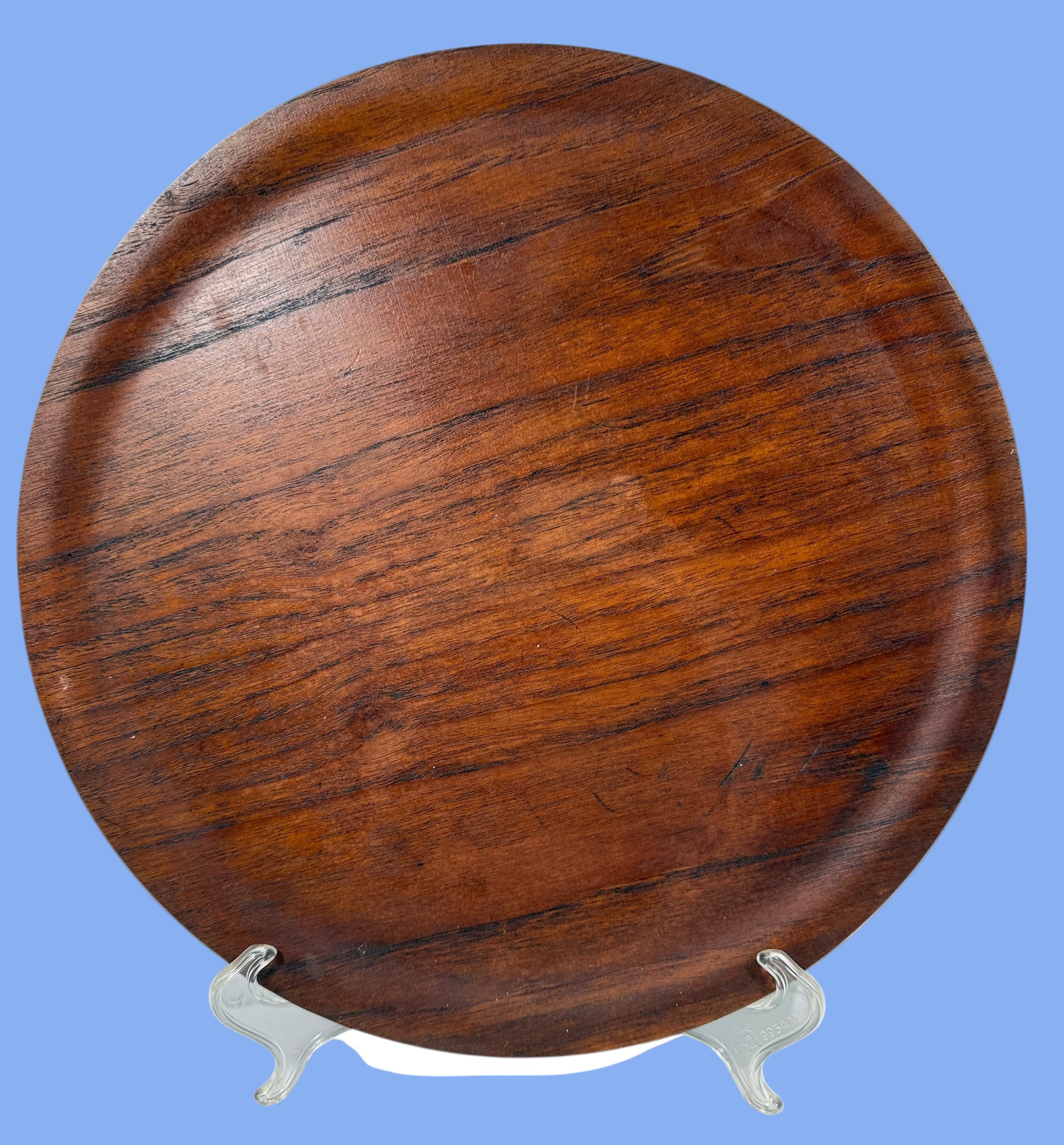 Made in Denmark Wooden round tray with metal stand on a white background