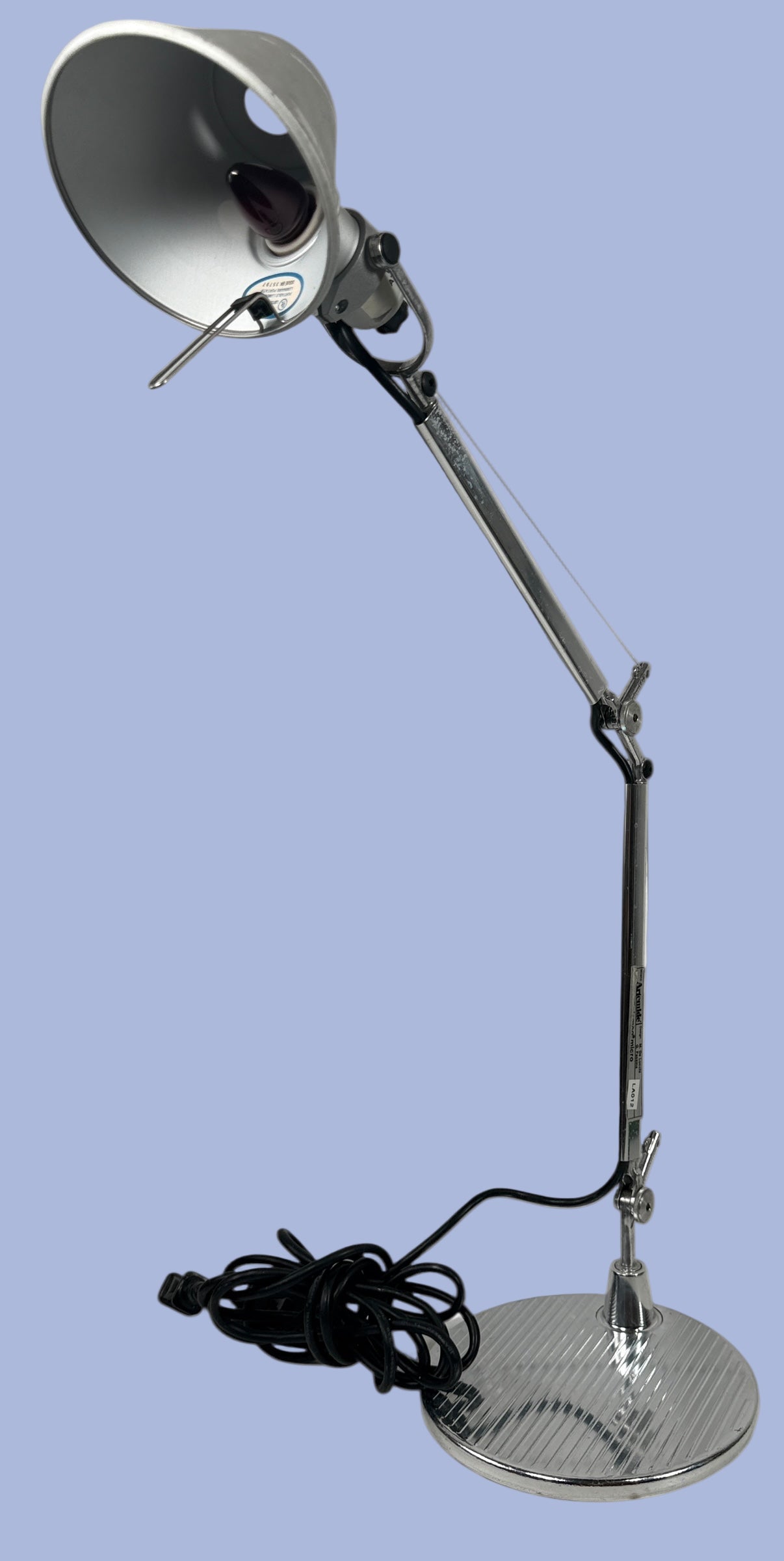 Artemide. Italy ,Metal desk lamp with adjustable arm on a white background