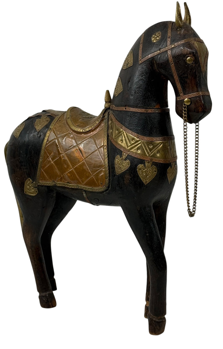 India Marwari folk art. Decorative horse figurine with black and gold details on a white background