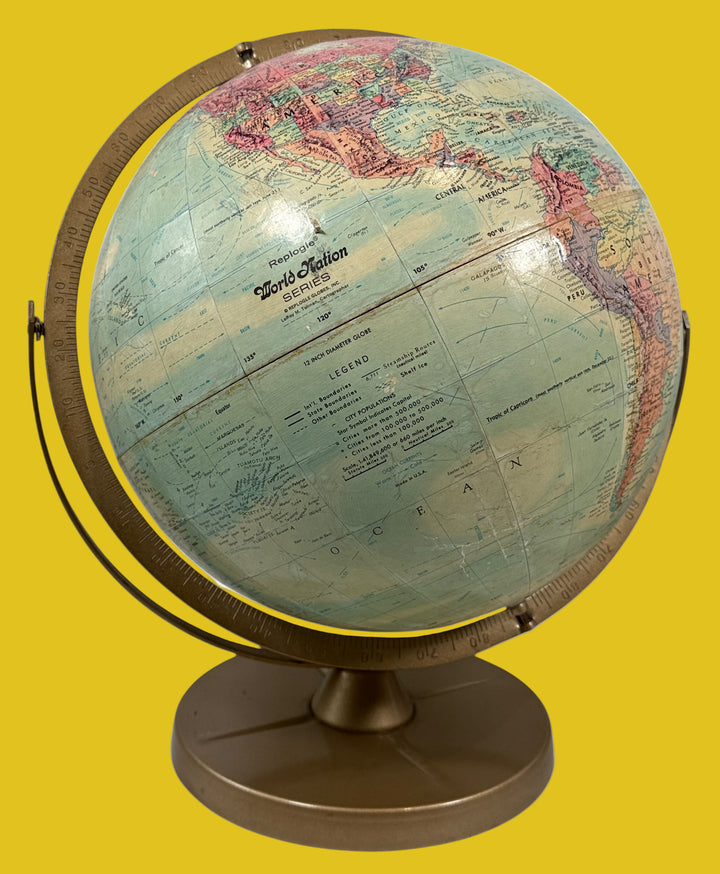 Repogle, World globe on a stand with a detailed map of the world. USA