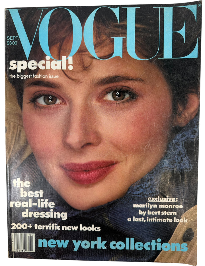 Vintage Vogue September 1982, magazine cover with a woman's face and text about fashion and collections.