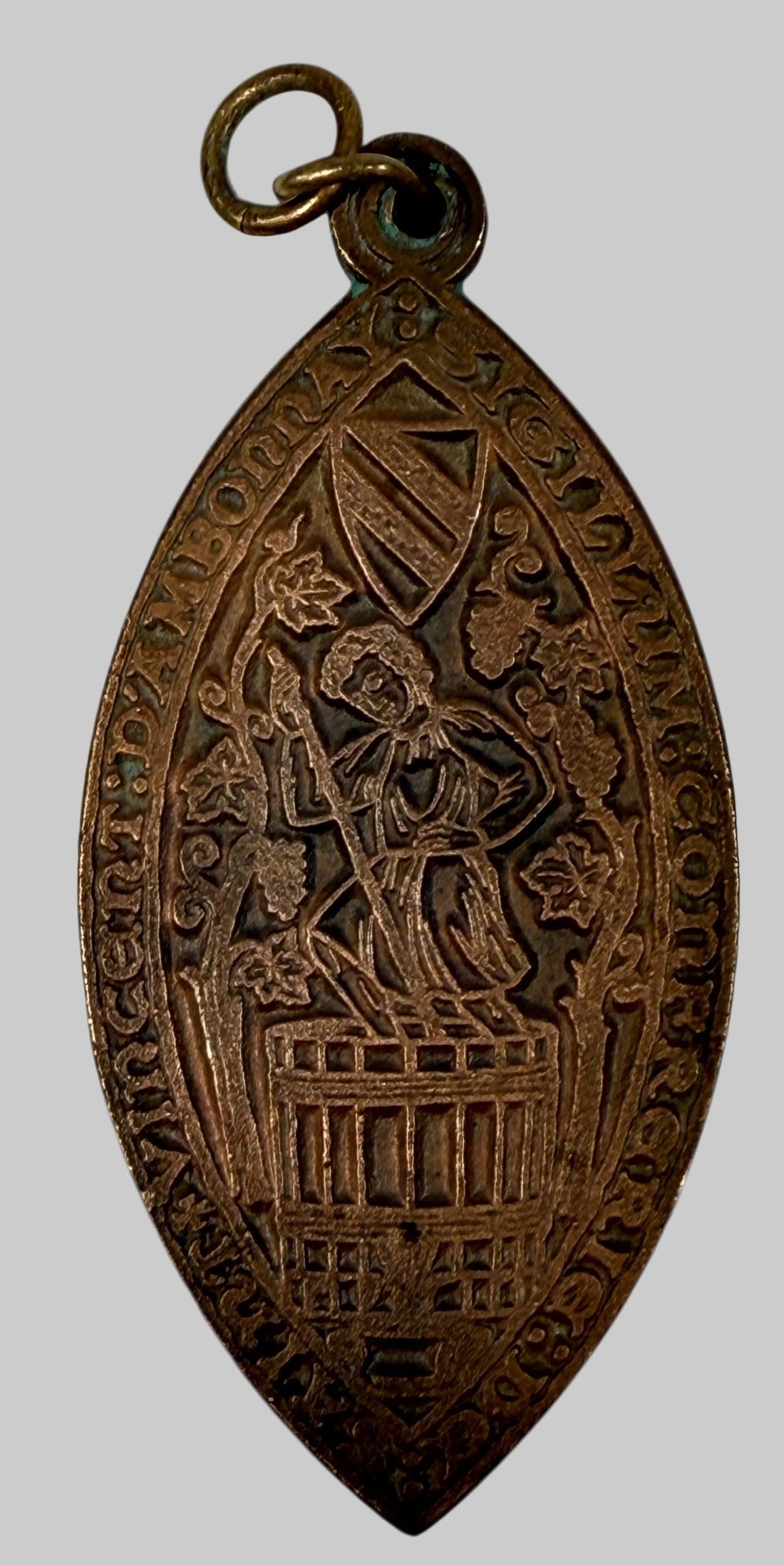 Vintage brass pendant of vintner treading grapes, medieval-seal style, 3″ statement medallion, European wine-guild reproduction, mid-century charm.