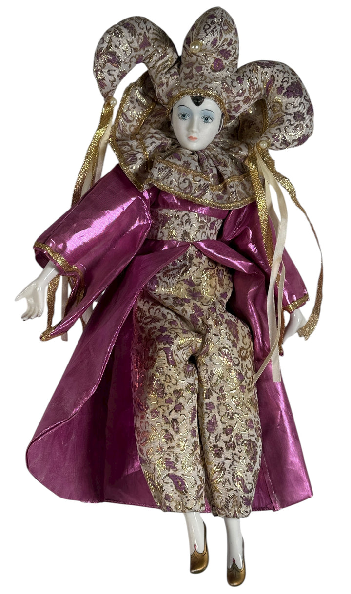 Vintage 18″ porcelain jester doll with mint satin and brocade costume. Elegant décor piece with porcelain head, hands, and feet.