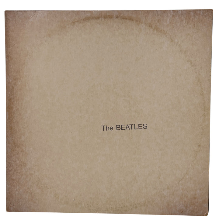 

Complete Canadian pressing of The Beatles White Album with poster and all four photos. Classic SWBO-101 2LP set for collectors and vinyl fans.
