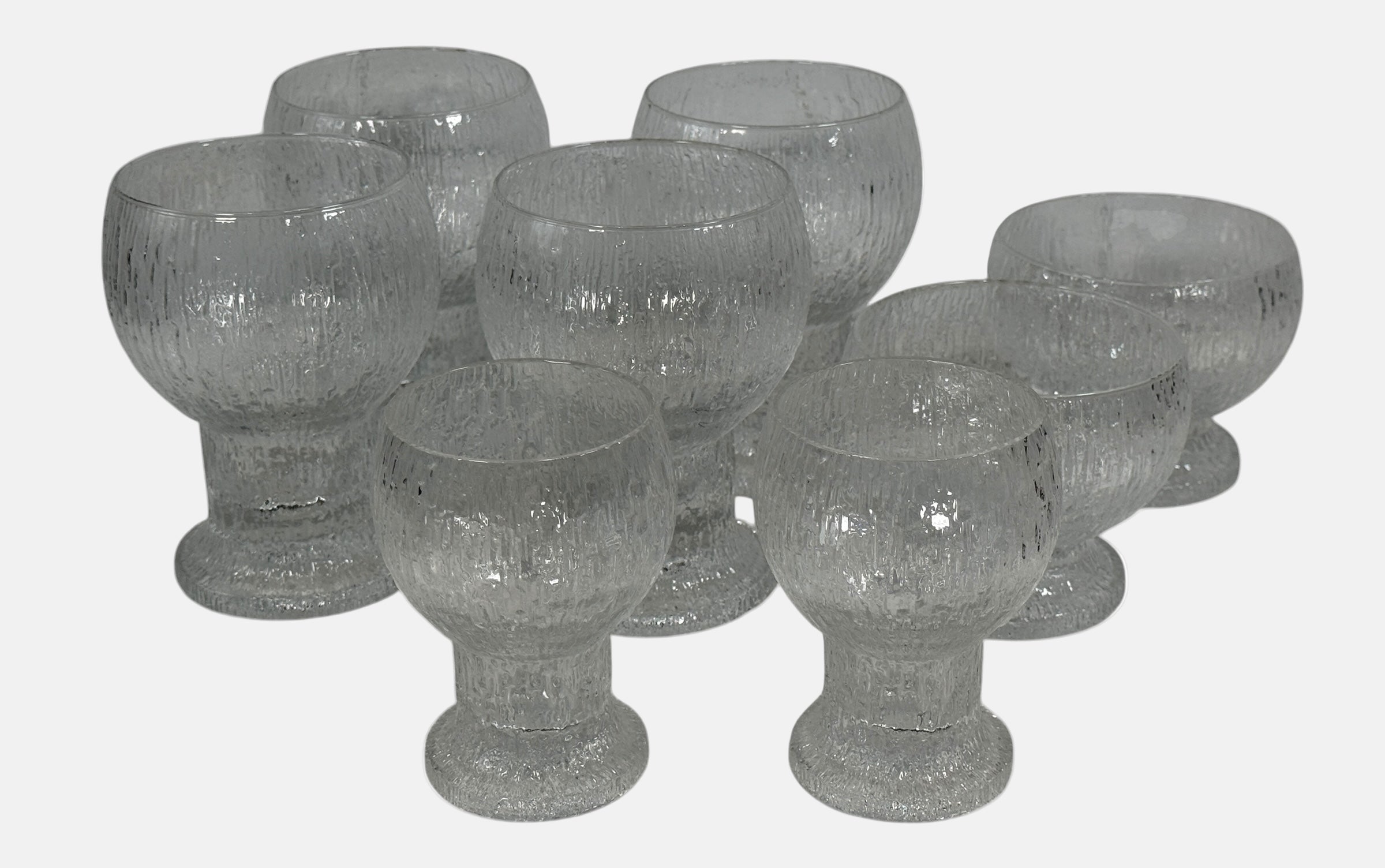 Vintage Iittala Ultima Thule footed glasses set of 8. Finnish design by Tapio Wirkkala. Iconic ice-melt texture. Excellent condition. Fast shipping from Canada.