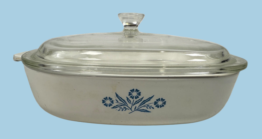 Vintage Corning Ware P-9 Blue Cornflower 9-inch casserole with glass lid. Canadian-made pyroceram cookware. Clean interior and functional vintage condition.