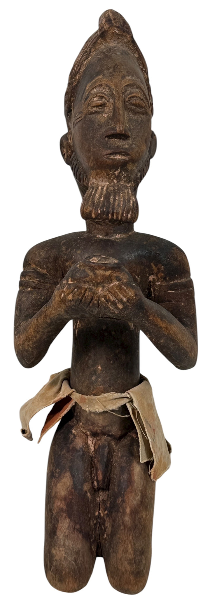 Mid-century African Baule-style carved kneeling figure with aged patina and cloth wrap. Vintage West African sculpture, approx. 11 inches tall.