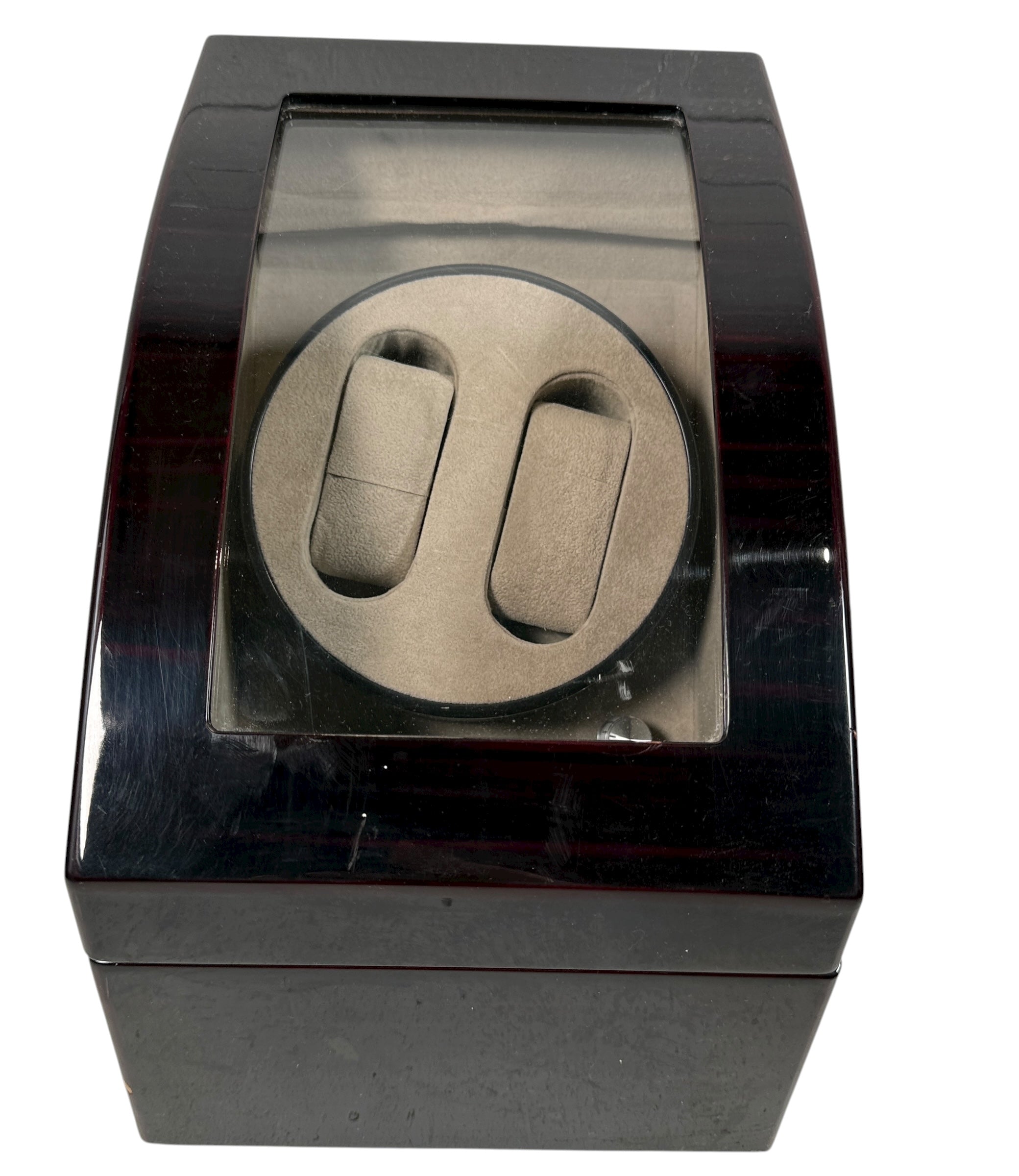 Working dual automatic watch winder in piano black lacquer with storage, display lid, and AC adaptor. Clean, functional, and perfect for protecting your watches.