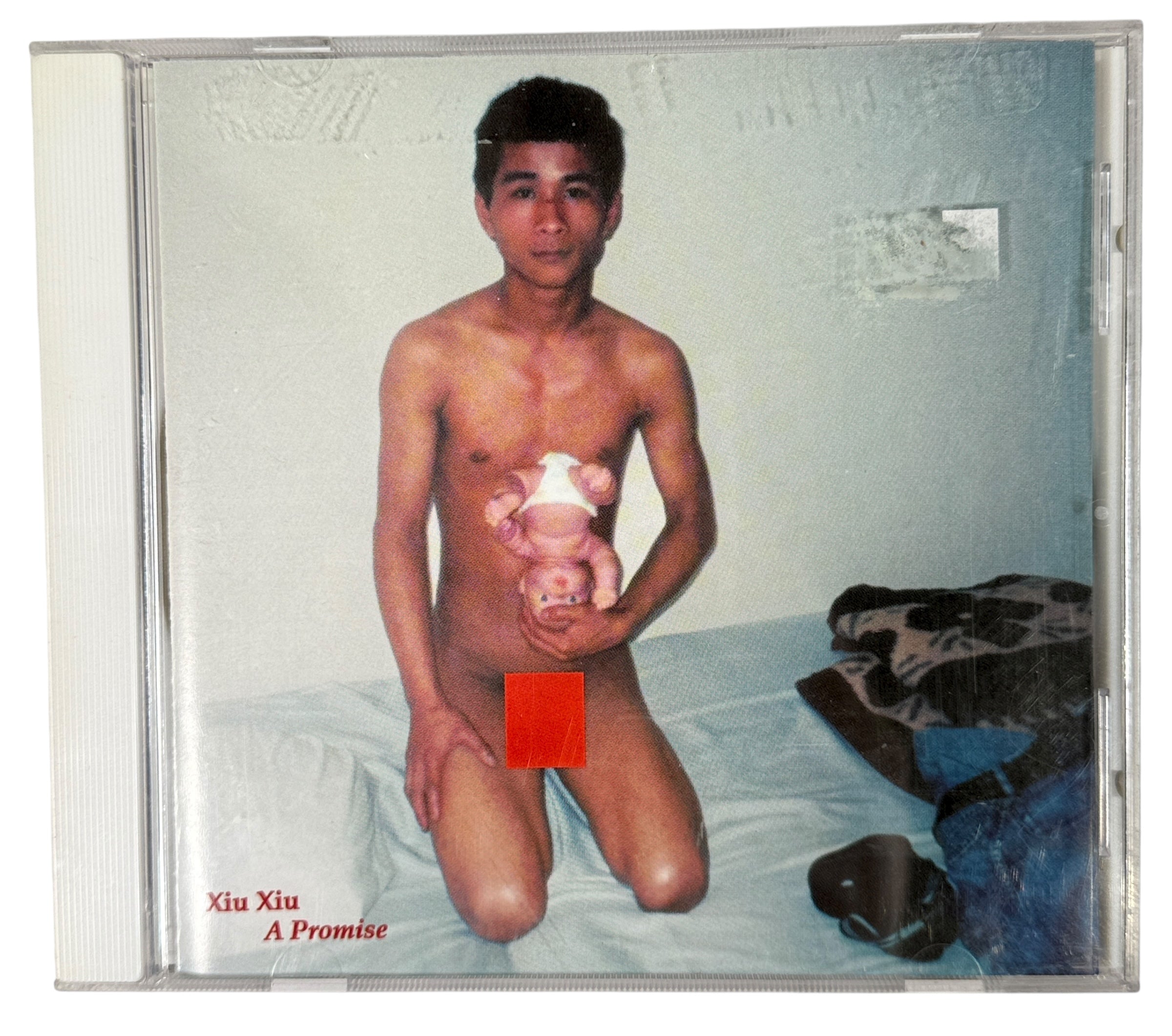 Xiu Xiu A Promise 2003 Canadian CD on 5RC. Original artwork with insert. Collectible early indie experimental release with strong fan demand.