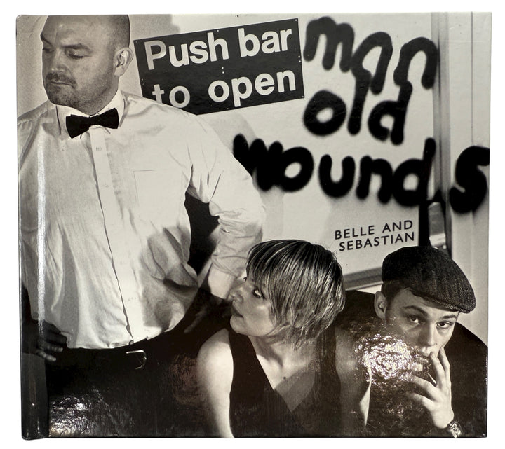 Album cover with text 'Push bar to open' and 'man old wounds' with a person in a tuxedo and another holding a drink.
