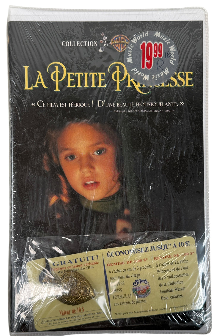 Sealed French-Canadian La Petite Princesse VHS with promo pendant and coupons. Rare Warner release in original shrink. Excellent collectible 90s film edition.