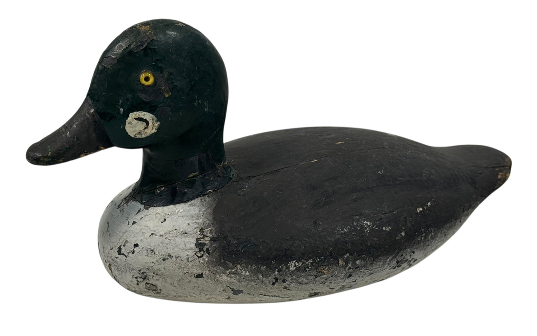 Vintage Quebec duck decoy attributed to Rivest of St-Sulpice. Hand-carved folk art with original ballast and authentic working wear. Collectible Canadian carving.