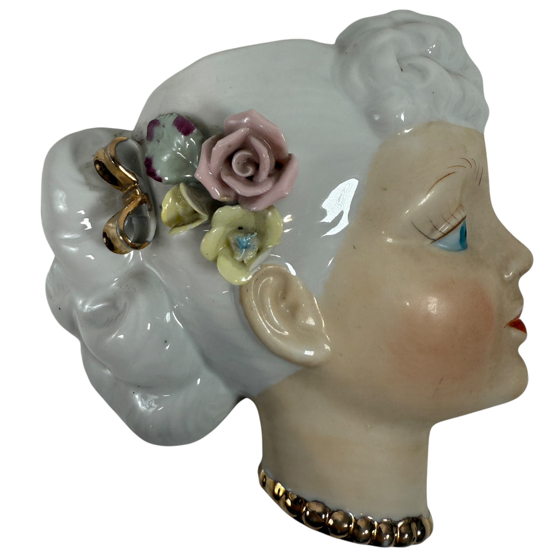 Mid-century Japanese porcelain lady-head wall mask with floral accents. Vintage décor piece with one chipped flower. Ideal for collectors and retro interiors.