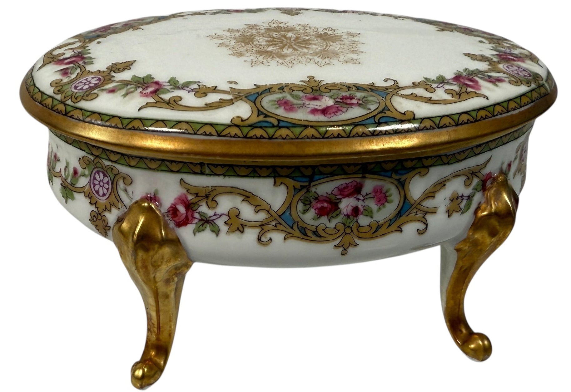 Antique French-style porcelain trinket box with gilt bronze legs, c.1900. Elegant vanity décor with floral details and classic Belle Époque charm.