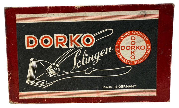 Vintage Dorko Solingen chrome #000 manual hair clipper with original box. German-made grooming tool for collectors, barbers, and vintage display.