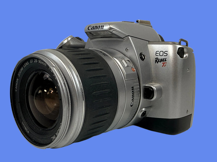 Canon Rebel Ti 35mm film camera with 28-90mm zoom lens. Early 2000s EF-mount SLR. Sold as-is. Great for film shooters, repair techs, and collectors.