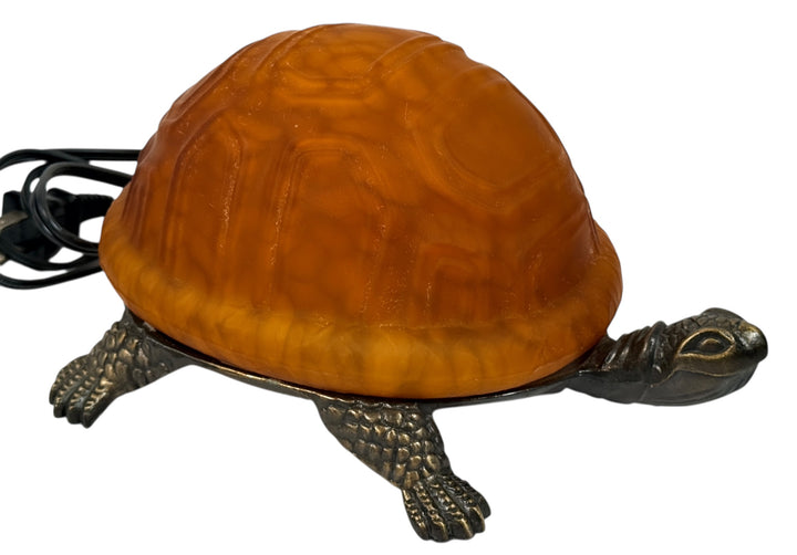 Mid-century turtle lamp with amber glass shell and bronze base. Warm ambient lighting for den, nursery, or cabin decor. Tested and in clean working condition.