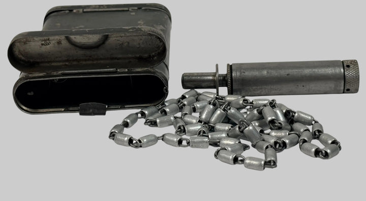 WWII German RG34 cleaning kit dated 1940 for K98k MG34. Complete with tin chain tool and wick. Original wartime issue with field wear. Collectible militaria.