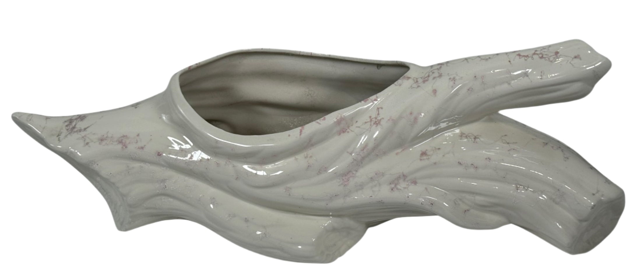 Ceramic planter shaped like a leaf on a white background