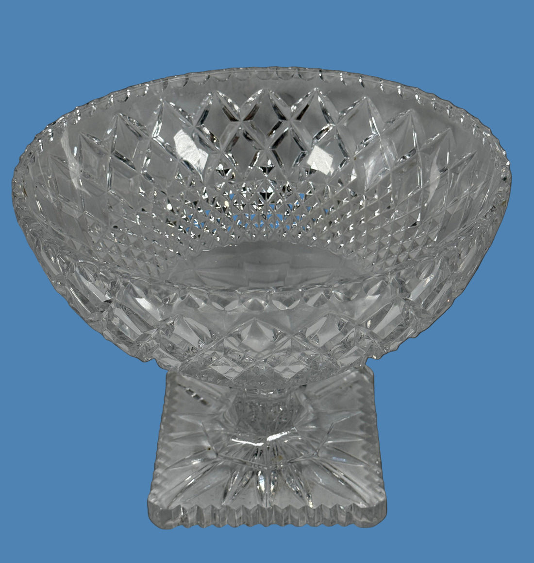 Clear crystal footed bowl on a black background