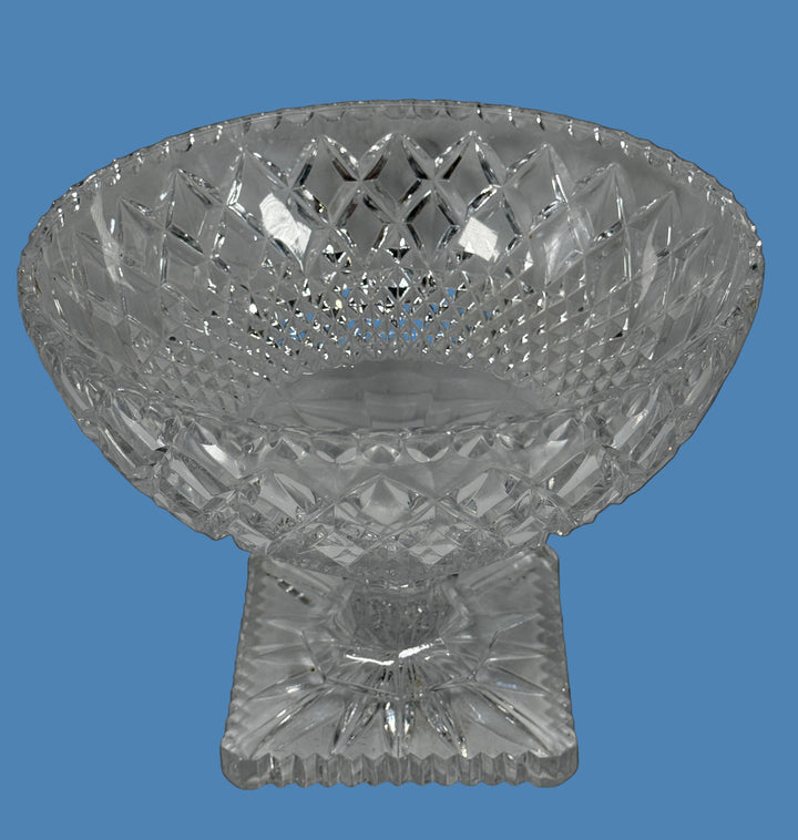 Clear crystal footed bowl on a black background