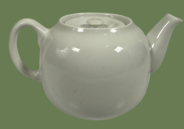 White ceramic teapot on a white background