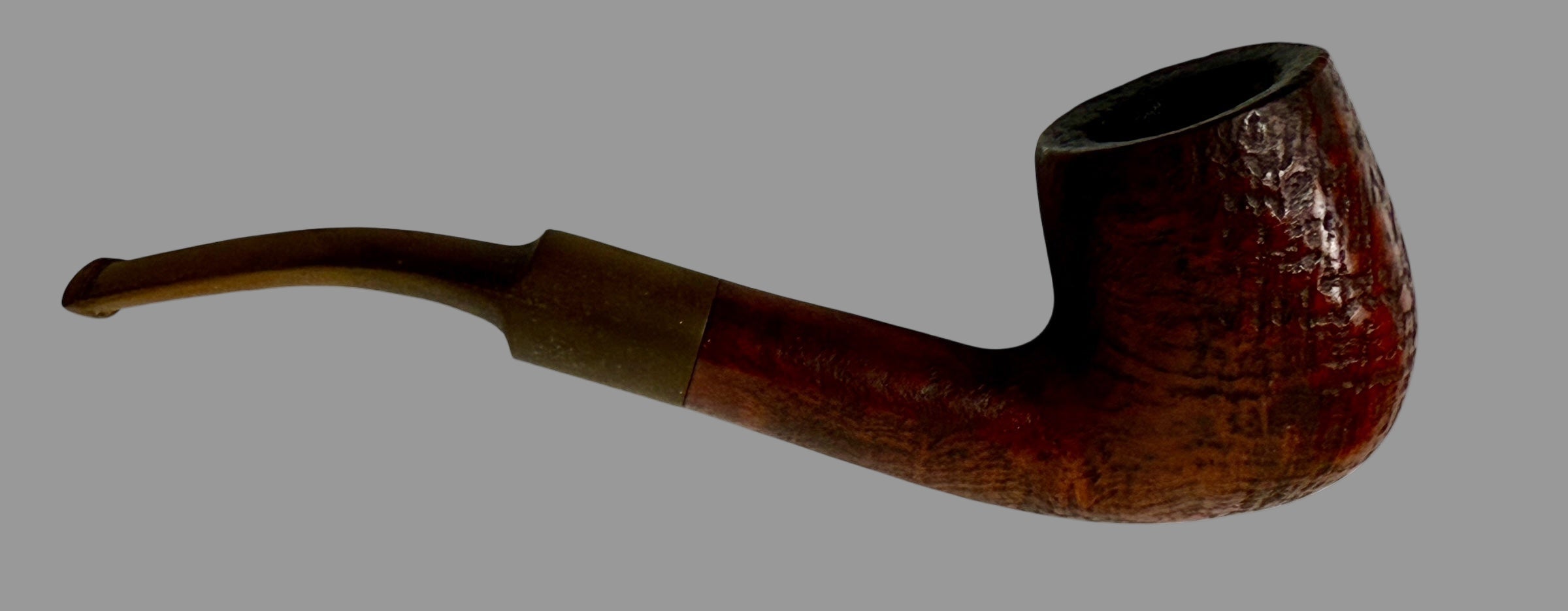Brown tobacco pipe on a white background
