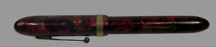 Black and red pen with decorative design on a white background, Penco