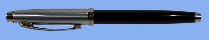 Schaeffer, Black pen with silver accents on a white background