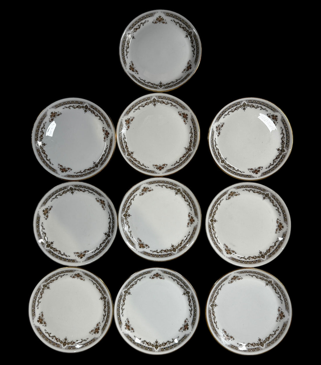 Set of 10 Royal Doulton Wardair , plates with decorative rim on a black background