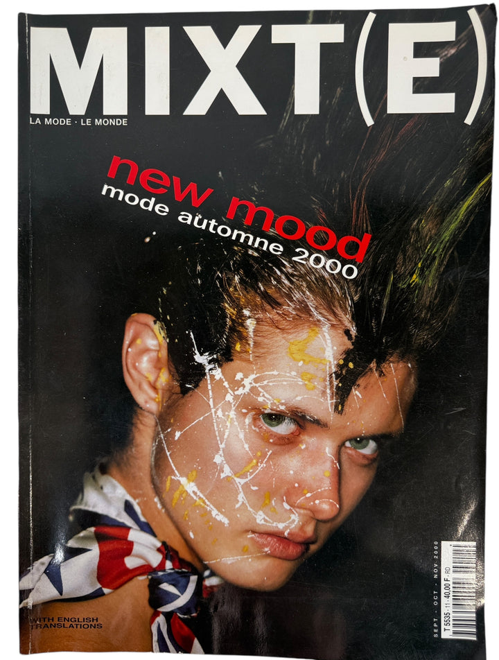 Magazine cover with a person's face and text 'MIXT(E) new mood mode automne 2000' on a dark background