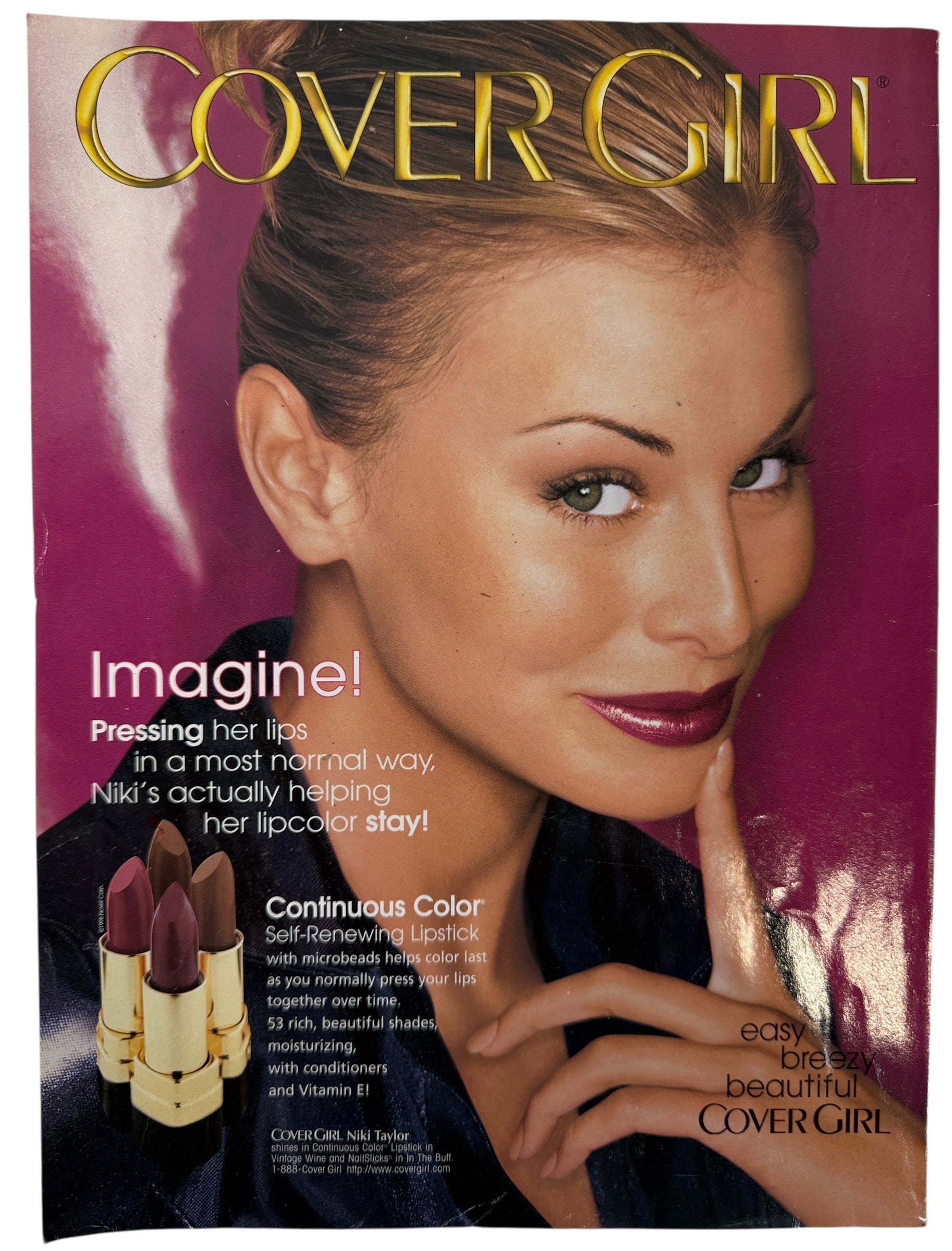 Vogue July 1998  magazine cover featuring a woman in a blue dress with text about fashion and lifestyle topics.