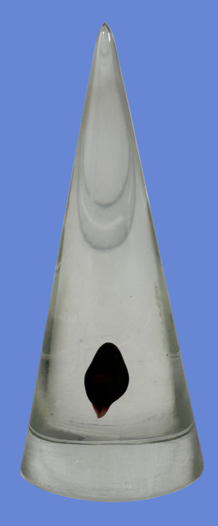 Vintage clear glass cone paperweight with dark red-brown inclusion. Mid-century modern décor collectible, polished base, unsigned art glass accent.