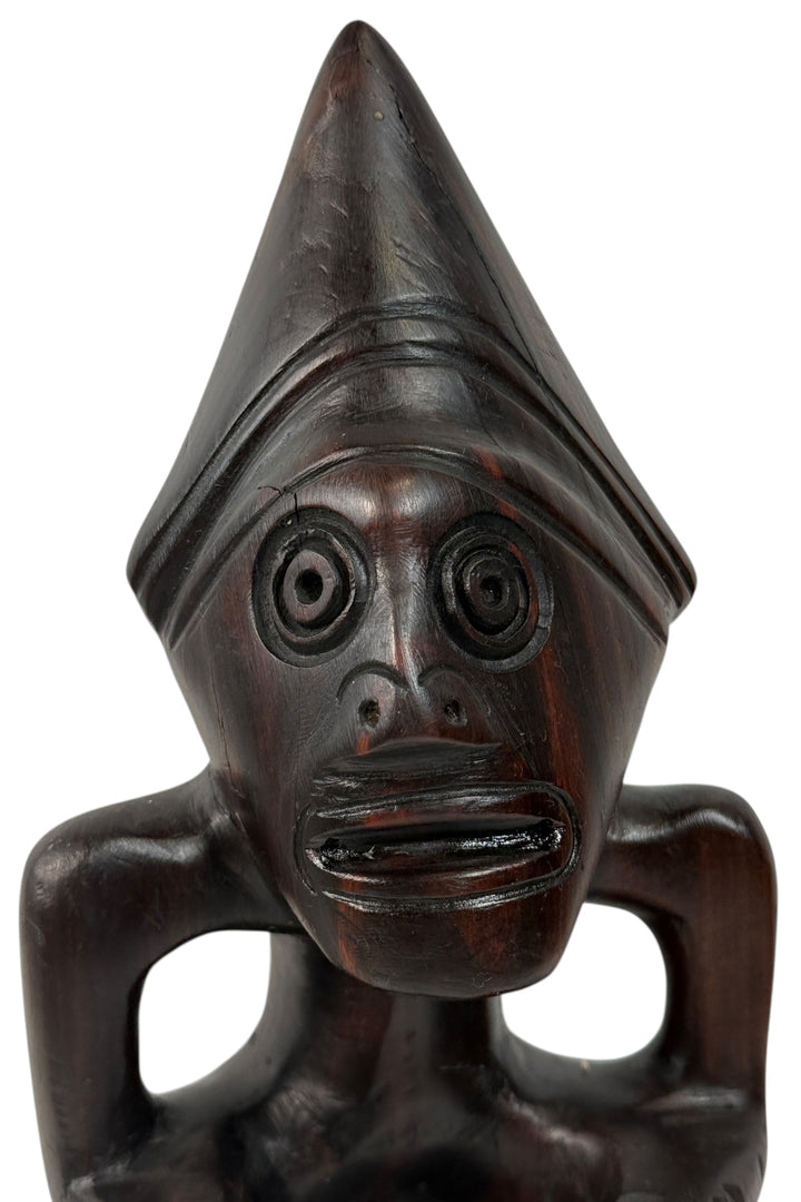 Mid-century African hardwood carving of crouching cone-head figure, hand-carved mahogany or sapele, export-era vintage art, 1950s–70s decorative sculpture.
