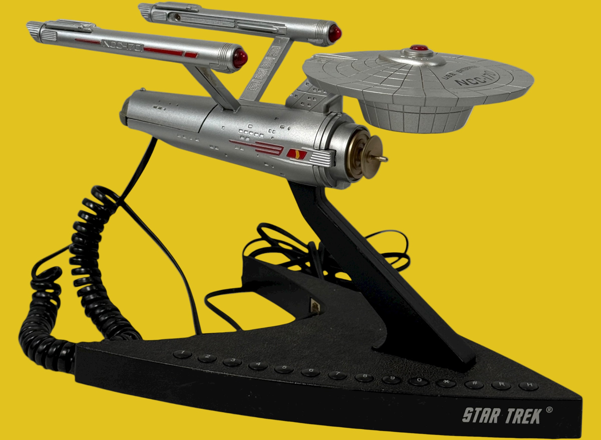 Official 1993 Telemania Star Trek USS Enterprise corded phone. Iconic NCC-1701 design, collectible display piece for Trekkies. Works and looks great.