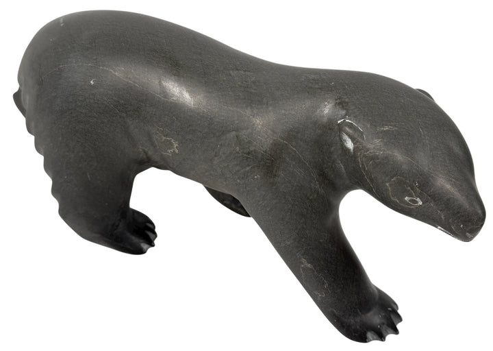Signed Inuit soapstone bear by Joe Ittukalak (2004) from Nunavik. 10-inch Canadian carving in dark stone—authentic Indigenous art sculpture.