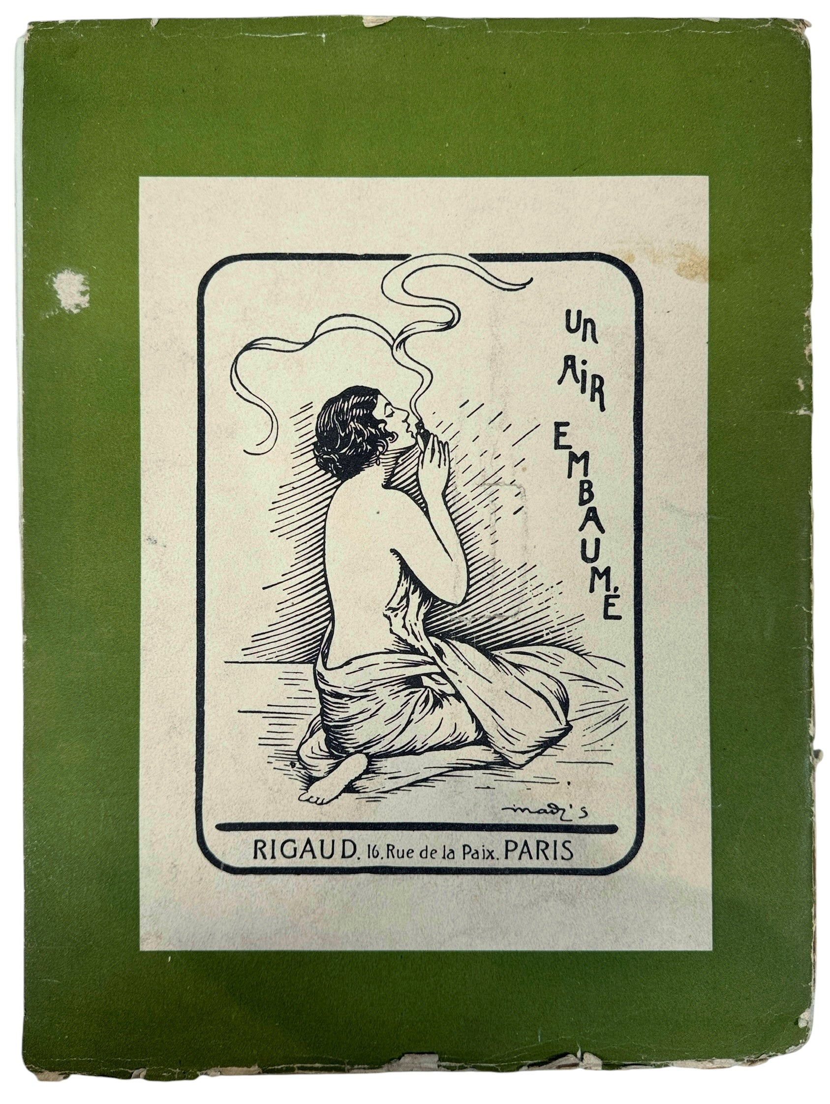 Vintage advertisement with a woman smoking, set against a green border.