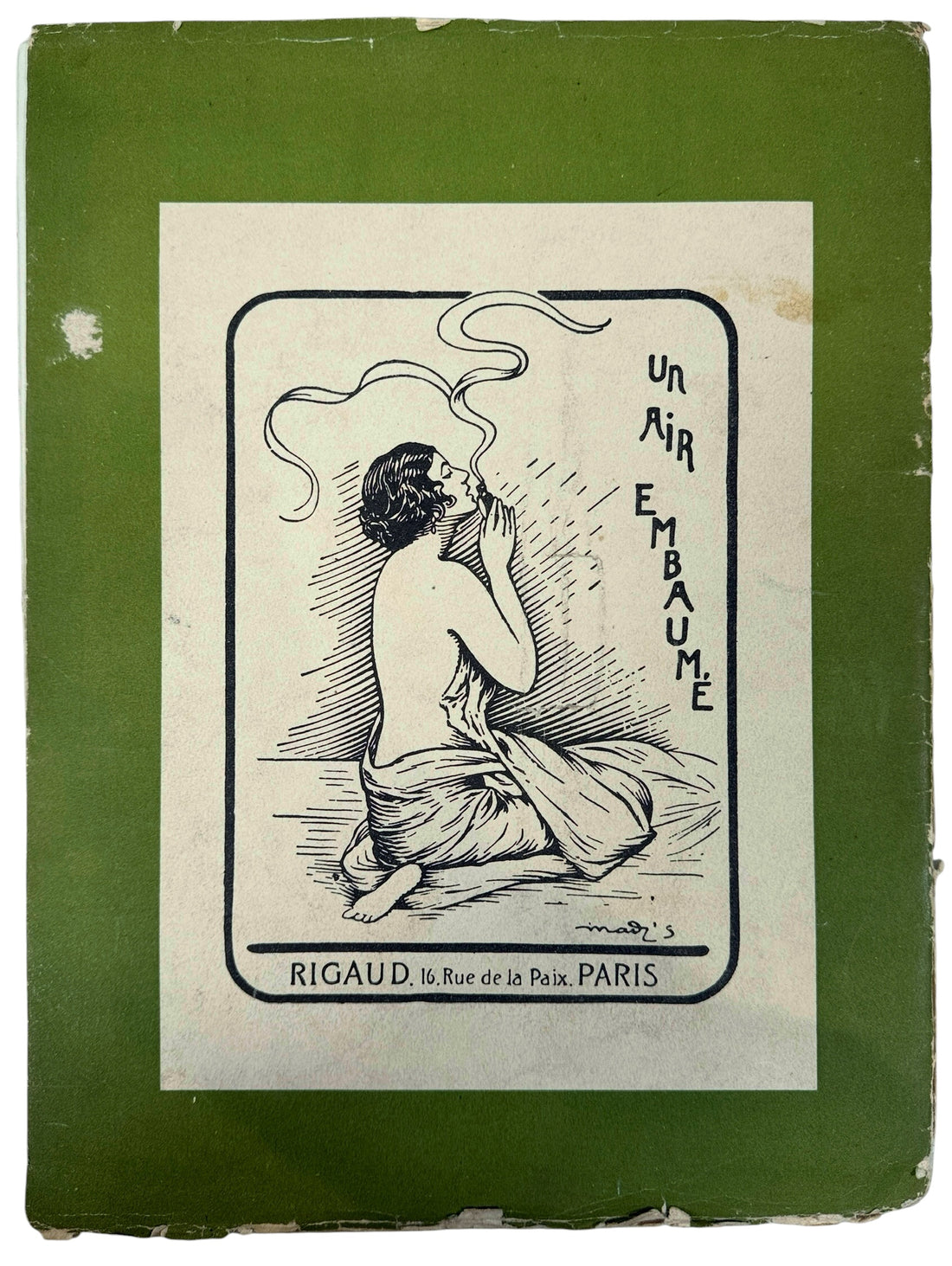 Vintage advertisement with a woman smoking, set against a green border.