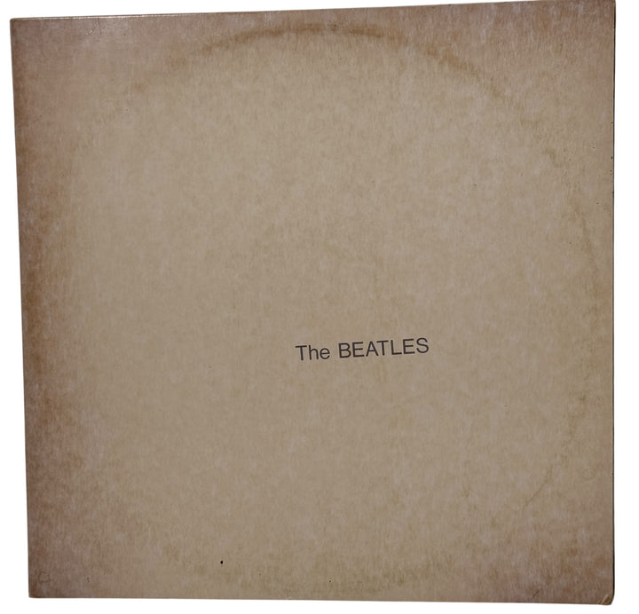 

Complete Canadian pressing of The Beatles White Album with poster and all four photos. Classic SWBO-101 2LP set for collectors and vinyl fans.