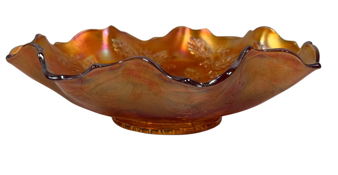 Decorative glass bowl with a wavy rim on a white background