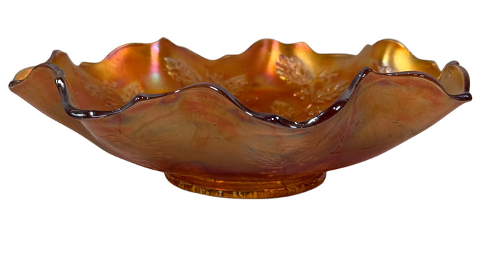 Decorative glass bowl with a wavy rim on a white background