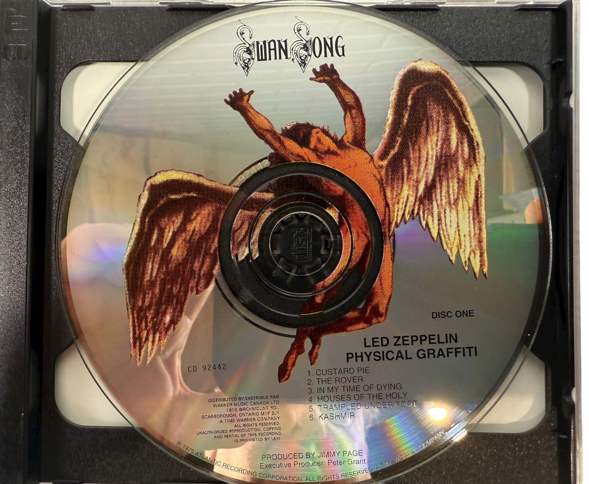 CD with an angel illustration and 'Swan Song' branding, featuring Led Zeppelin's 'Physical Graffiti'.