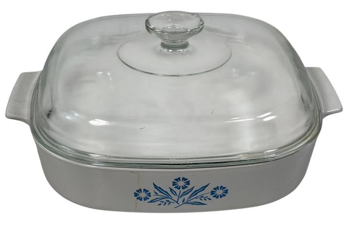 Glass-covered ceramic baking dish with floral design on a white background